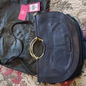 Vince Camuta leather and jean bag with silver sequin and colored trim.